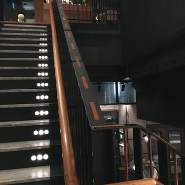 Black metal staircase with marble steps and lighting accents, by Pengelly Iron Works 