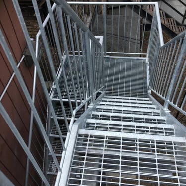 Outdoor industrial grating fire-escape type stairs, by Pengelly Iron Works 