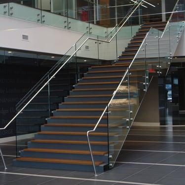 Dark grey metal stairs at Kumon office, by Pengelly Iron Works