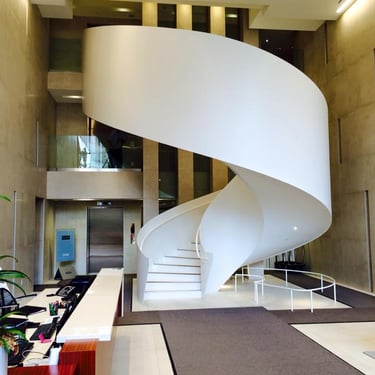 Uniquely beautiful elliptical feature staircase in residential building's lobby, by Pengelly Iron Works