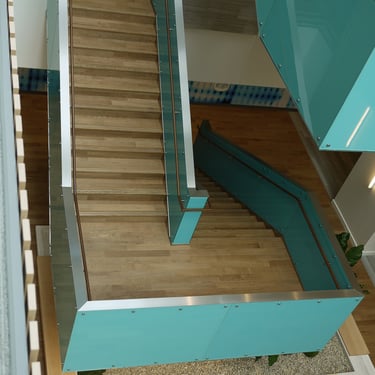Top down angle of Roche's blue modern feature stairs, by Pengelly Iron Works