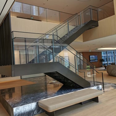 Third angle of Scotiabank North's marble and metal feature stairs by Pengelly Iron Works