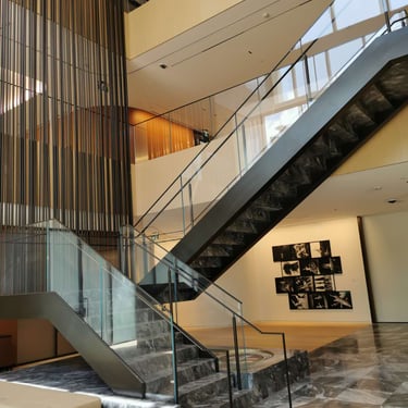 Second angle of Scotiabank North marble feature stairs, by by Pengelly Iron Works