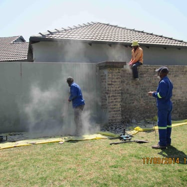 Stripping of brickwork plaster from boundary wall, Brackenhurst, Gauteng
