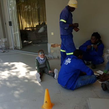 Workers on lunch break at work site, Fourways