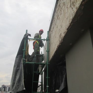 Mechanical chipping of compromised exterior plaster works, Sandhurst Towers, Fredman Drive