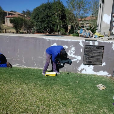 Filling cracks in walls for sanding in preparation for Painting, Rustenburg