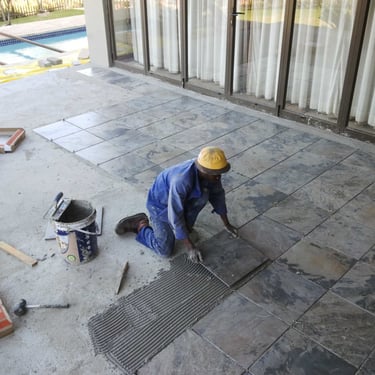 Tiling works after the screed layer has cured, Safari Gardens, North West Province