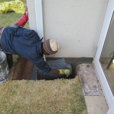 Specialized sealer coat application for foundation layer bricks below ground level to prevent ingress, Randburg