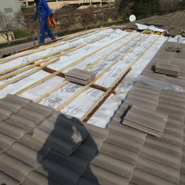 Inspecting underlying newly constructed wooden structure to accommodate new roof tiles, Hyde Park