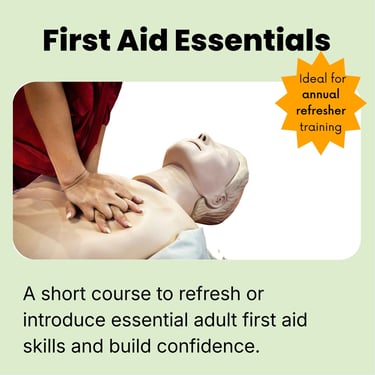 a person is  learning CPR and doing chest compressions on a first aid training manikin 