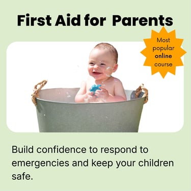 Smiling baby playing with bubbles in a tin bathtub