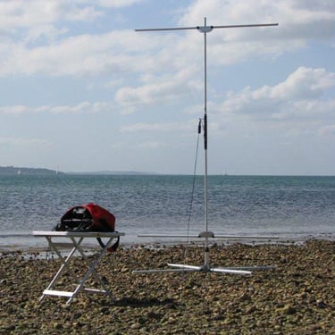 Pro Antennas I-Pro Traveller HF antenna set up on a stony beach