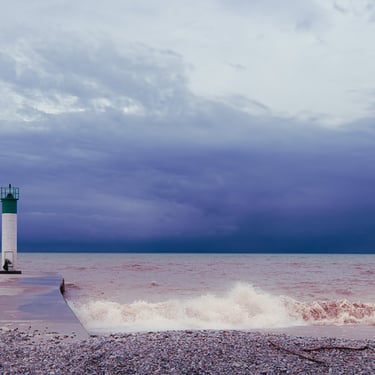 Man walking dog on a Pier.