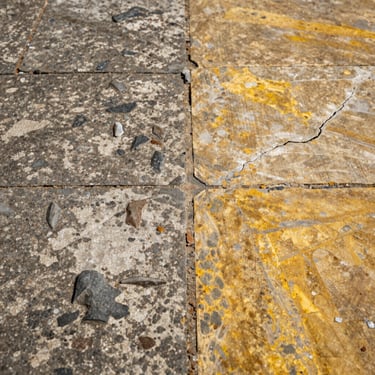 Close-up split showing a weathered, salt-damaged outdoor stone floor next to a freshly restored, vibrant section.