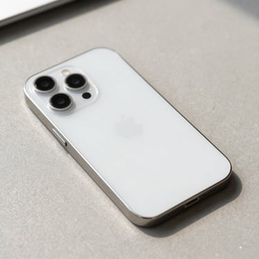 Close-up of a clean iPhone 15 Pro Max in natural light on a neutral slate surface