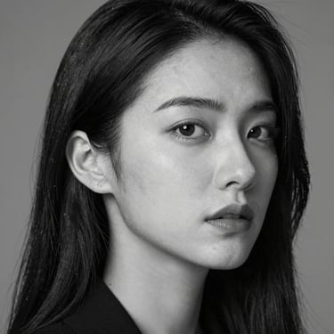 High-contrast black and white portrait of a female performance media buyer, sharp side-lighting, professional, close-up framing