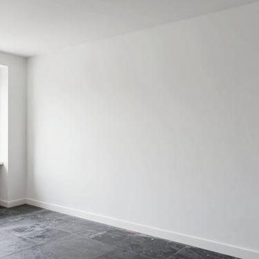 Wide shot of a modern apartment interior with immaculate, flat plasterboard walls ready for decoration