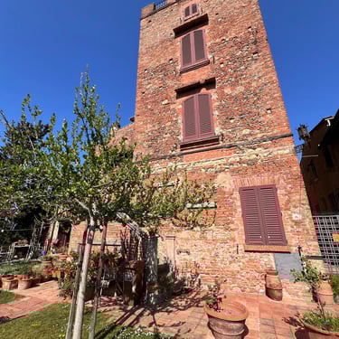 Stunning medieval brick tower with a private garden terrace in Certaldo Alto, Tuscany. Ideal historical property