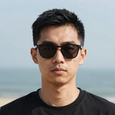 Smiling woman working on a laptop in a cozy home office.