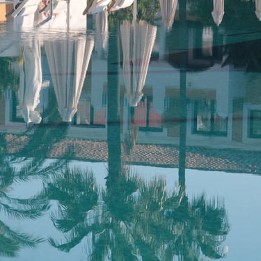 The only reflection you get from a hotel pool at sundown. Probably in Sancti Petri, Andalusia, Spain.