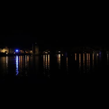 Real night in Avignon, France. The reflected lights come from the Pont Saint-Bénézet, the famous half-bridge over the Rhône.