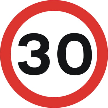 A circular road sign with a red border and the number 30 in black, indicating a 30 mph speed limit.