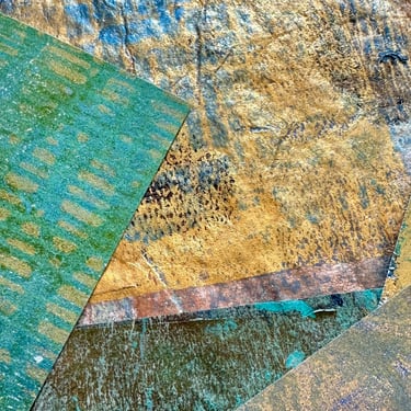 Blue and gold collage papers with layered stencil pattern