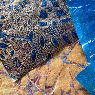 Blue and gold collage papers with geometric stencil patterns