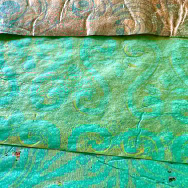 Teal and gold collage papers with swirling stencil patterns