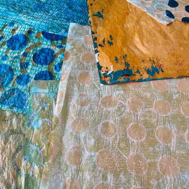 Blue and gold collage papers with geometric stencil patterns