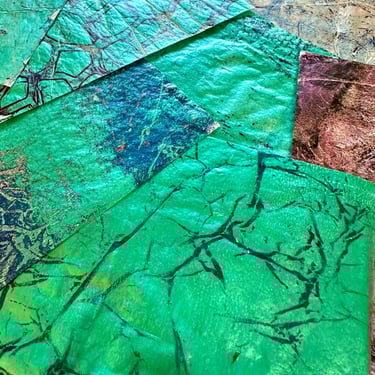 Green hand-painted collage papers with layered paint texture