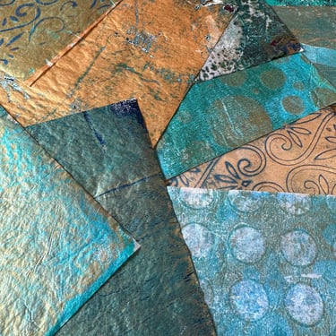 Teal and copper collage papers arranged in layered composition