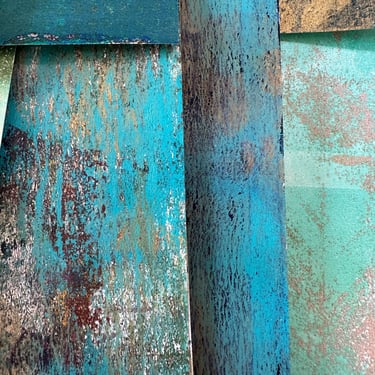 Weathered teal painted surface with textured layers