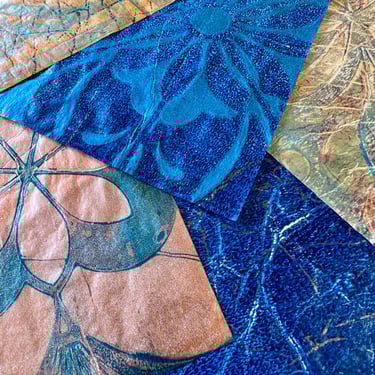 Blue collage papers with layered botanical stencil patterns