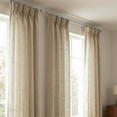 Elegant traditional curtains made of natural linen hanging from a sleek European track in a warm residential living room, soft folds, 35mm