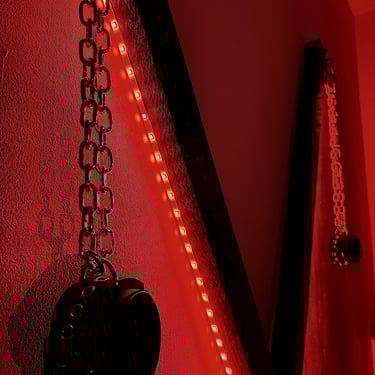 Hand-made-leather-restraints-in-a-red-light-setting