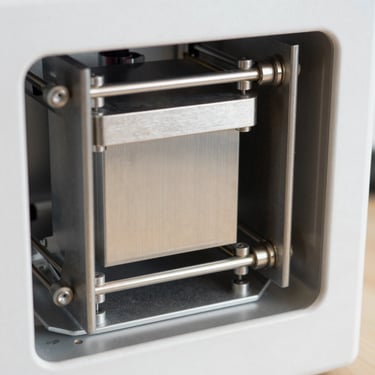 Close-up of the Kangen K8 ionization chamber internal structure, platinum-titanium electrodes visible, clean technical product photography, neutral background, no dramatization