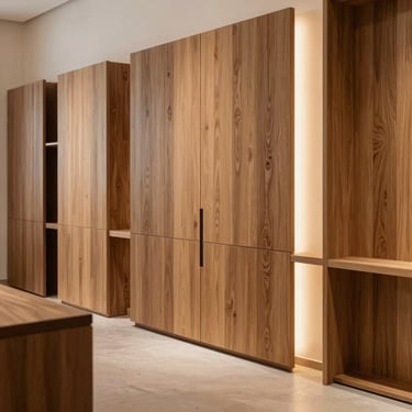 Wide architectural interior shot of a minimalist luxury woodworking showroom in Riyadh, showcasing premium oak timber wall panels and bespoke furniture, warm tactile side-lighting, rich organic wood textures, sharp details