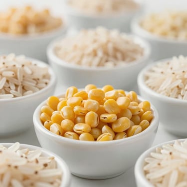 Macro shot of organic yellow pulses and basmati rice in minimalist white ceramic bowls, soft daylight, high-end editorial