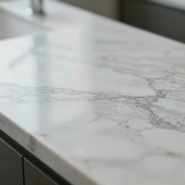 Extreme close-up macro shot of a polished marble countertop, completely streak-free, reflecting soft natural daylight, clinical cleanliness, minimal composition.