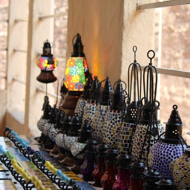 Rajasthan trip details - Rows of vibrant, handcrafted mosaic lanterns showcasing the region's heritage.