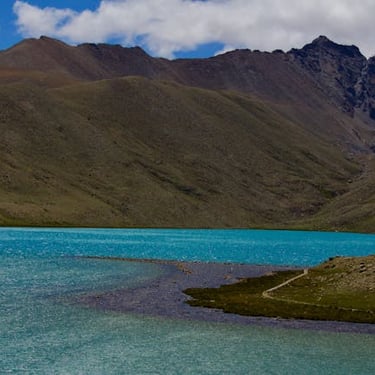 North East trip details - Vibrant turquoise waters of a high-altitude Himalayan lake surrounded by rugged peaks