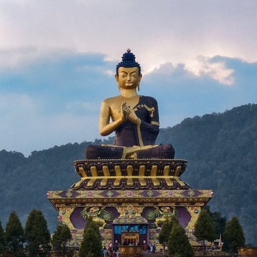 North East trip details - Majestic golden Buddha statue at Namchi, Sikkim, overlooking the misty green mountains