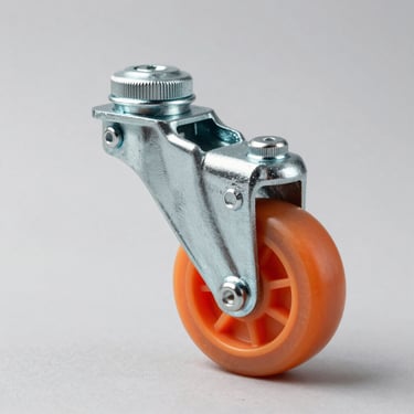 Studio product shot of a single orange polyurethane light-duty caster wheel, zinc-plated steel bracket, high-contrast side-lighting, isolated on a clean light-grey background.