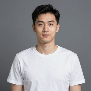 Smiling man standing next to a sleek black car in a modern showroom.