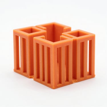 Macro shot of a matte orange architectural model printed in high resolution, sharp focus, clean studio lighting