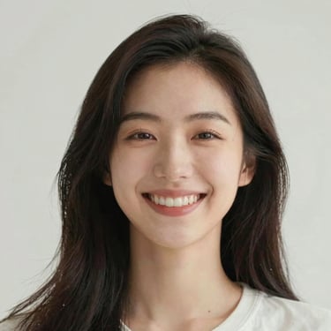 A happy person sitting at a desk, smiling while using a laptop with coaching tools on screen.