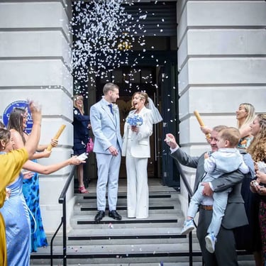 wedding couple on the steps of Camden Town Hall