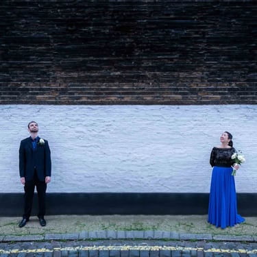 Newly-weds walking around the quiet streets of Marylebone after being married at Old Marylebone Town Hall